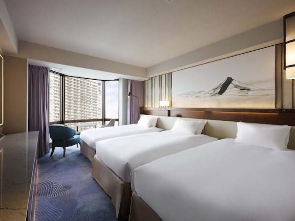 A hotel room with two beds, a desk, a chair, and a large window with curtains. - Asakusa View Hotel (Tokyo)