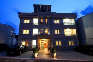 Front of property - evening/night - Apartments Holiday (Petrovac)