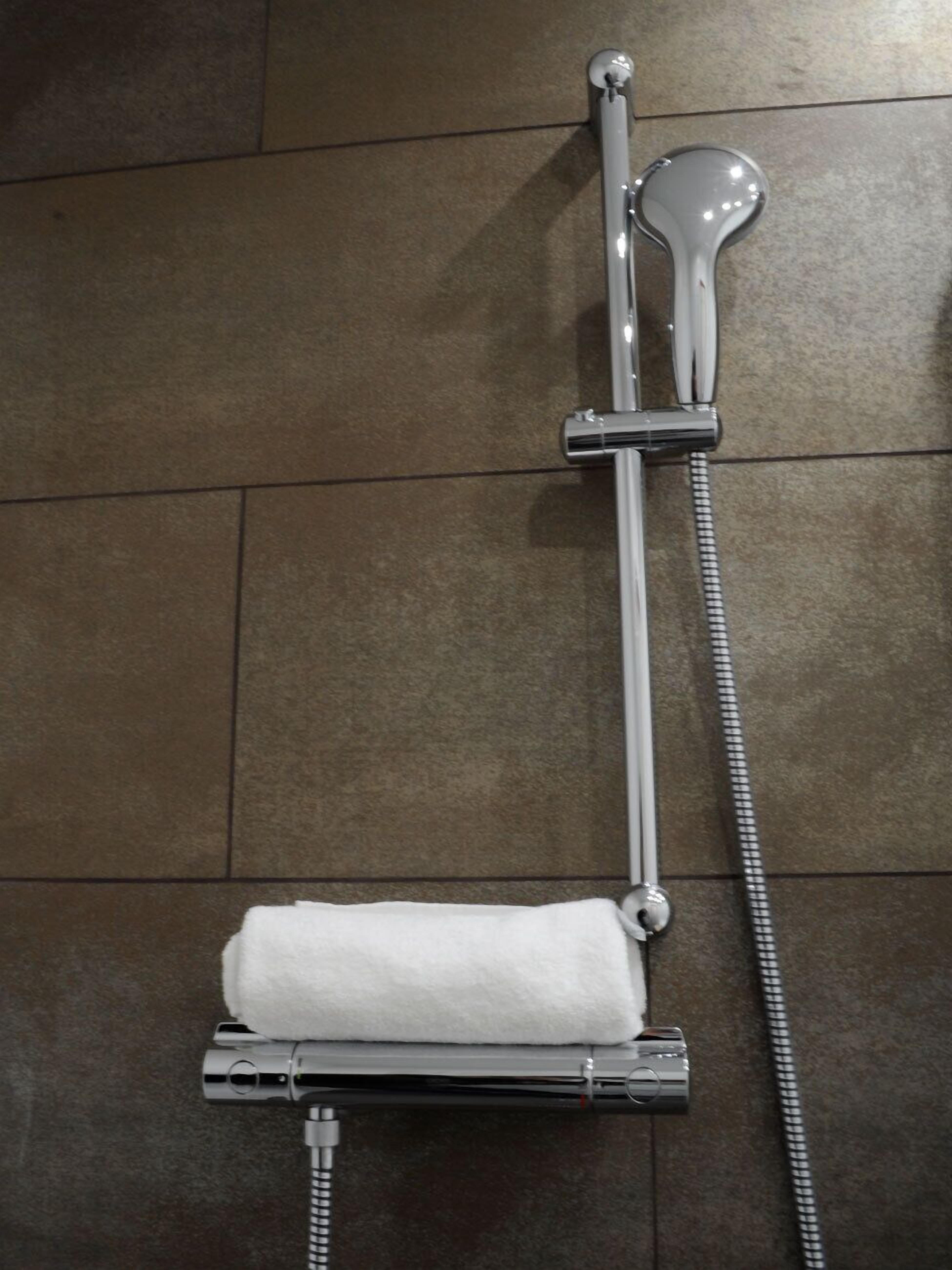 comfort double room, 1 king bed, non smoking, city view | bathroom | shower, free toiletries, hair dryer, towels