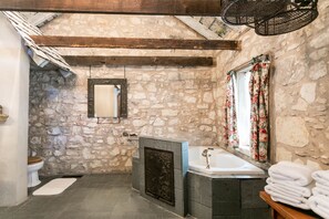 Suite, 1 King Bed (Kristin's) | Bathroom | Combined shower/bathtub, jetted bath, free toiletries, towels - Austin Street Retreat - Kristin's (Fredericksburg)