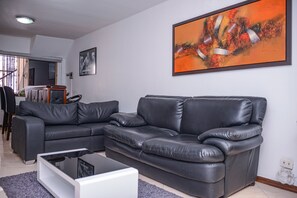 Comfort Apartment, 3 Bedrooms, Hot Tub, City View | Living area | 39-inch flat-screen TV with cable channels, TV