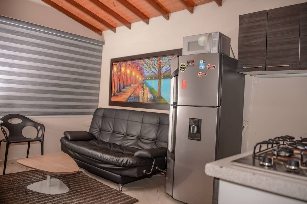 Deluxe Apartment, 1 Bedroom, Hot Tub, City View | 1 bedroom, in-room safe, individually decorated, individually furnished
