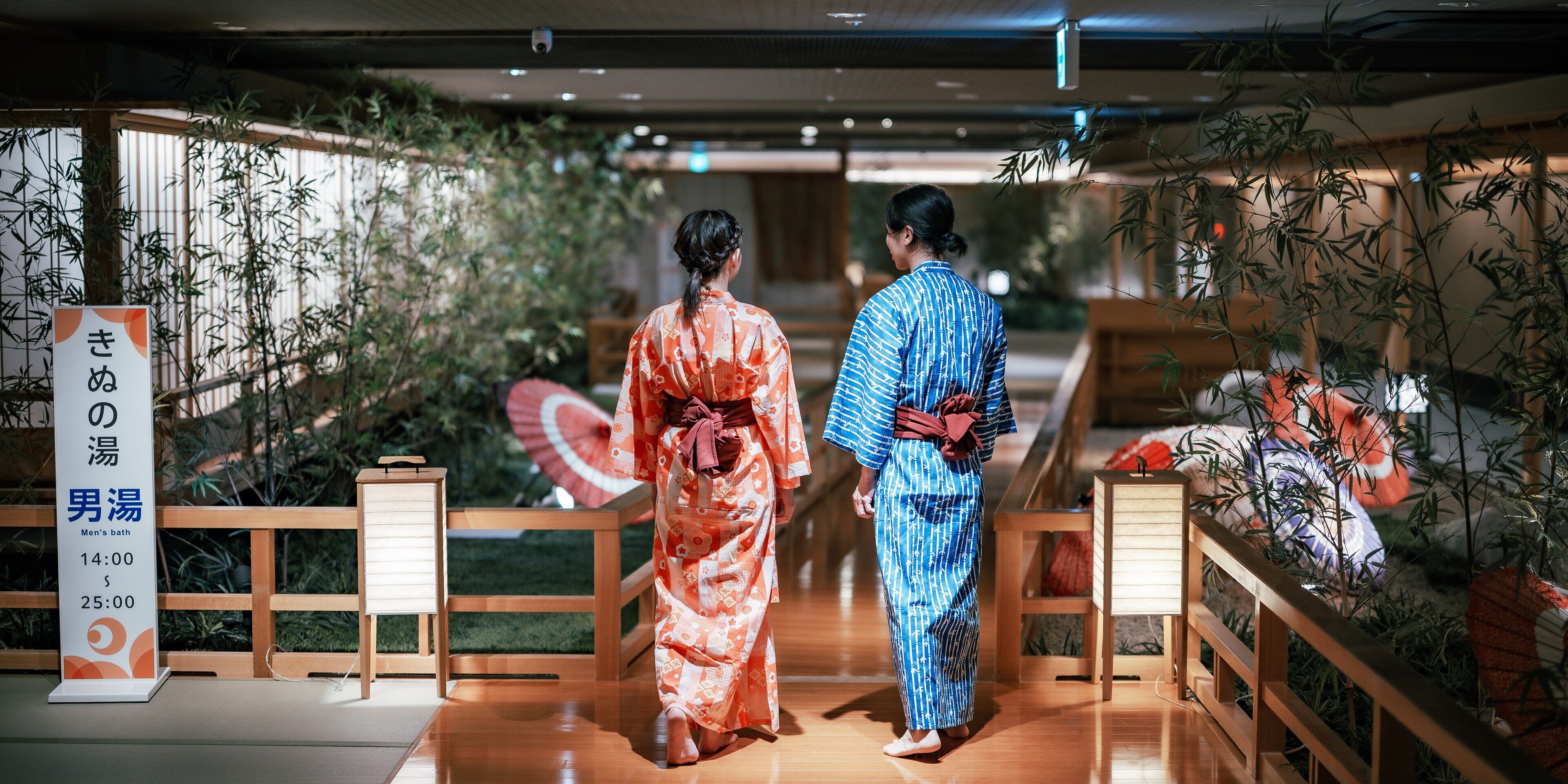 A traditional Japanese setting with tatami flooring, a wooden railing, and bamboo plants.