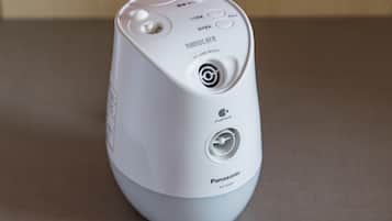 A white Panasonic EH-SA45 device with a circular button, a small display, and a charging port.