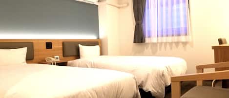 Twin Room, Non Smoking | 1 bedroom, down comforters, in-room safe, desk