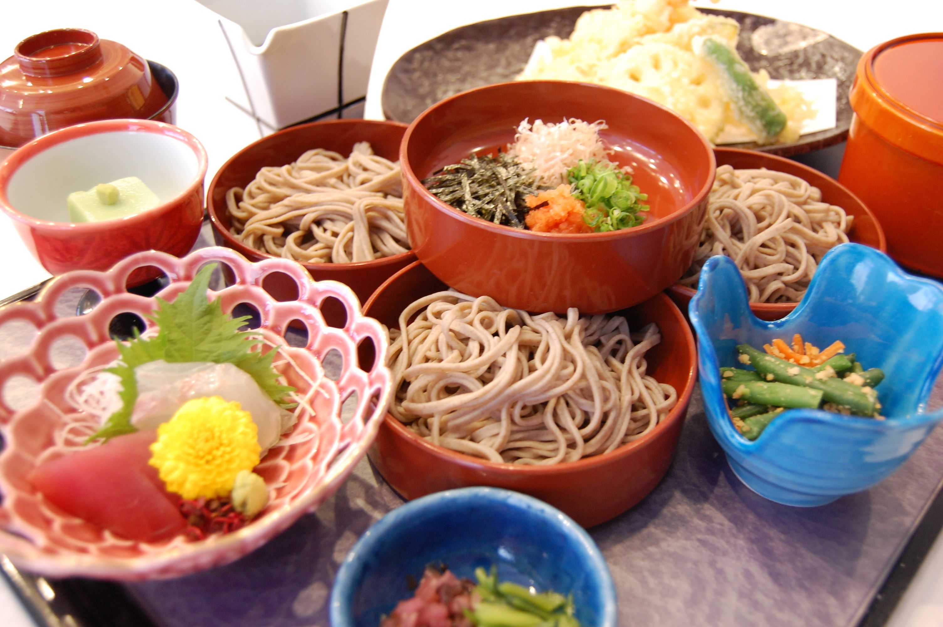 A variety of bowls containing different types of food, likely part of a meal or buffet.