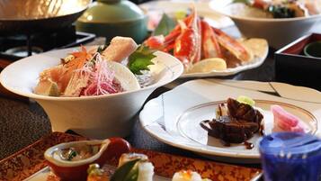 A variety of dishes on a table, including seafood and a bowl of soup.