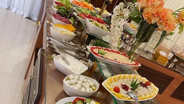 A buffet with various food items including salads, fruits, and cheese. - Sama Inn Hotel (Riyadh)