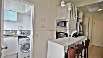 Deluxe Apartment, City View | Desk, blackout curtains, iron/ironing board