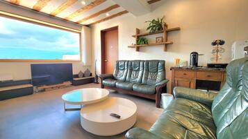 Family Villa, 3 Bedrooms | Living area | 50-inch flat-screen TV with cable channels, TV, heated floors