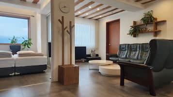 Family Villa, 3 Bedrooms | Living area | 50-inch flat-screen TV with cable channels, TV, heated floors