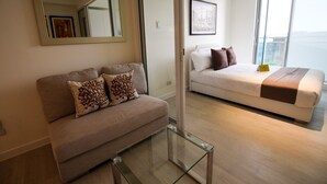 1 Bedroom City View  | Living room | Flat-screen TV - Siglo Suites @ The Azure Urban Resort Residences (Parañaque)