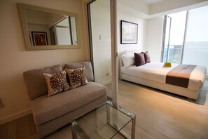 1 Bedroom City View  | Living room | Flat-screen TV - Siglo Suites @ The Azure Urban Resort Residences (Parañaque)