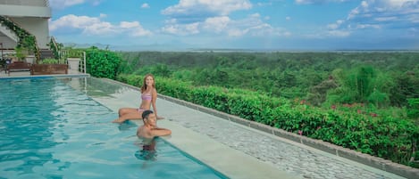 Outdoor pool, open 8:00 AM to 9:30 PM, pool umbrellas, pool loungers