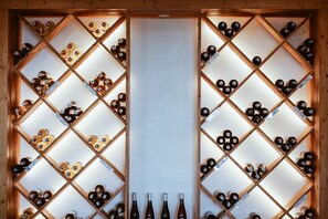 A wine cellar with wooden racks and bottles. - Panja Resort Palawan (Puerto Princesa)