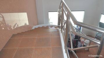 A staircase with metal railings, leading to a lower level.