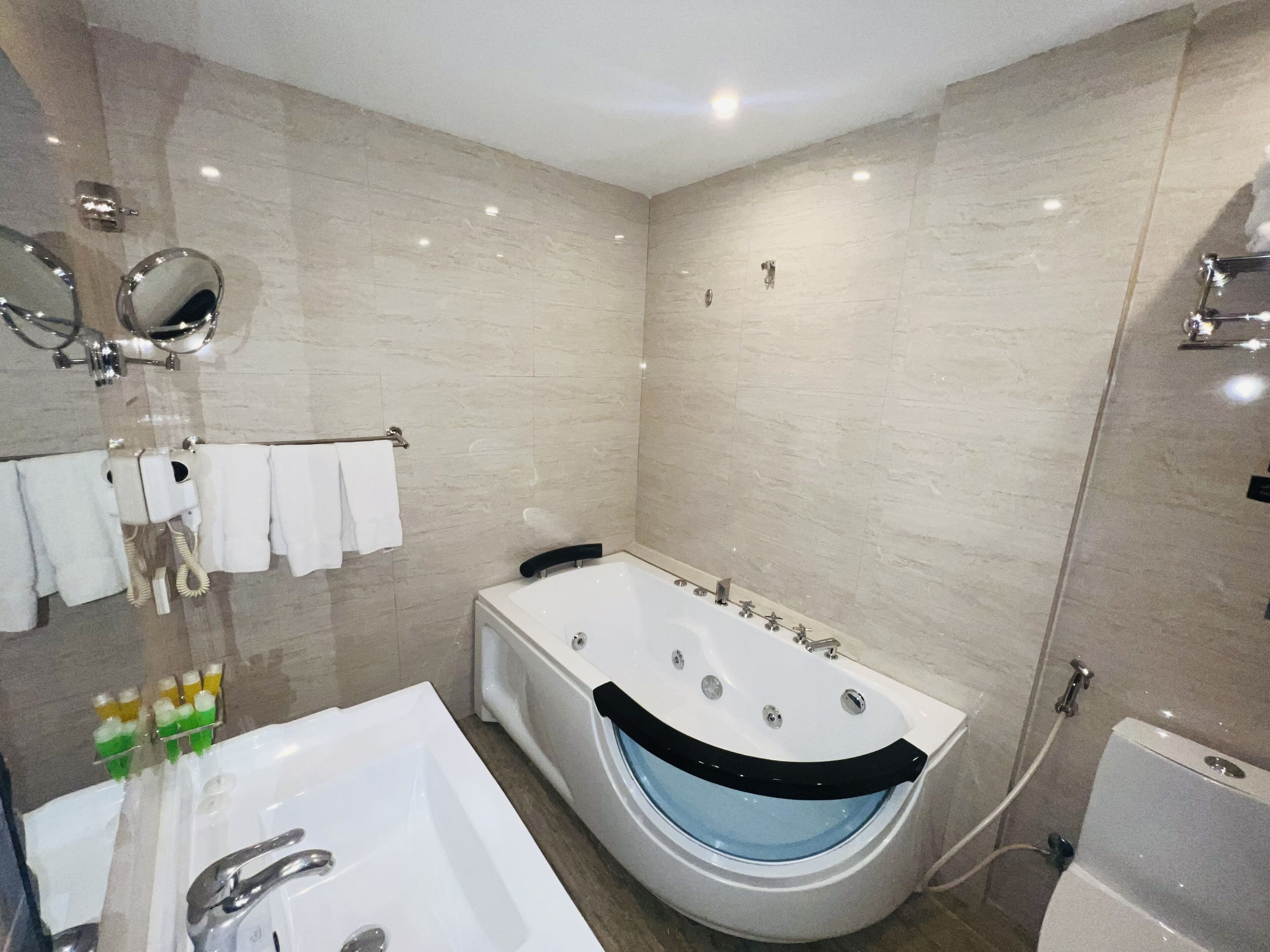 deluxe suite with spa bath | bathroom | free toiletries, hair dryer, bathrobes, slippers
