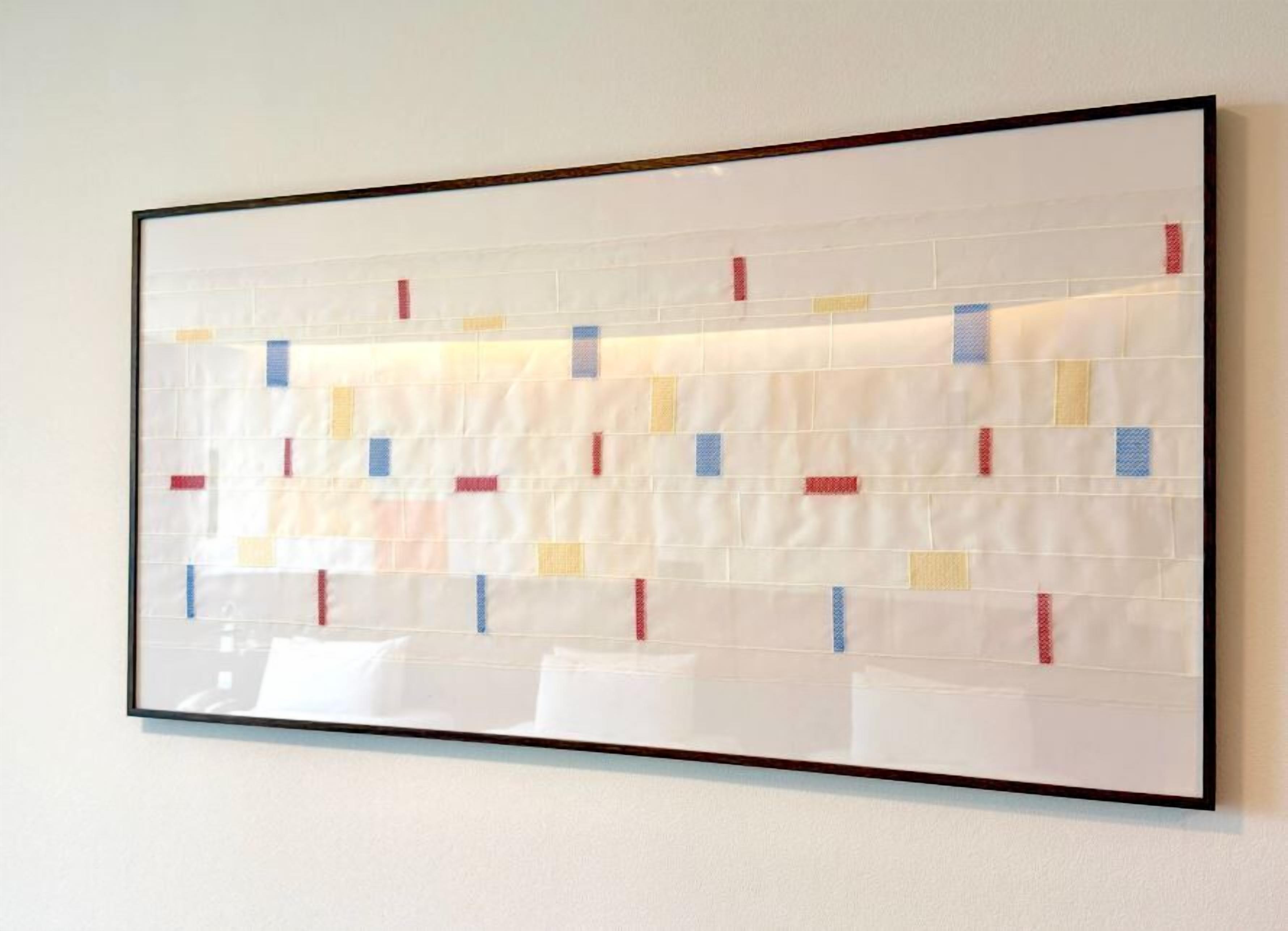 A wall with a geometric pattern of rectangles in various colors.