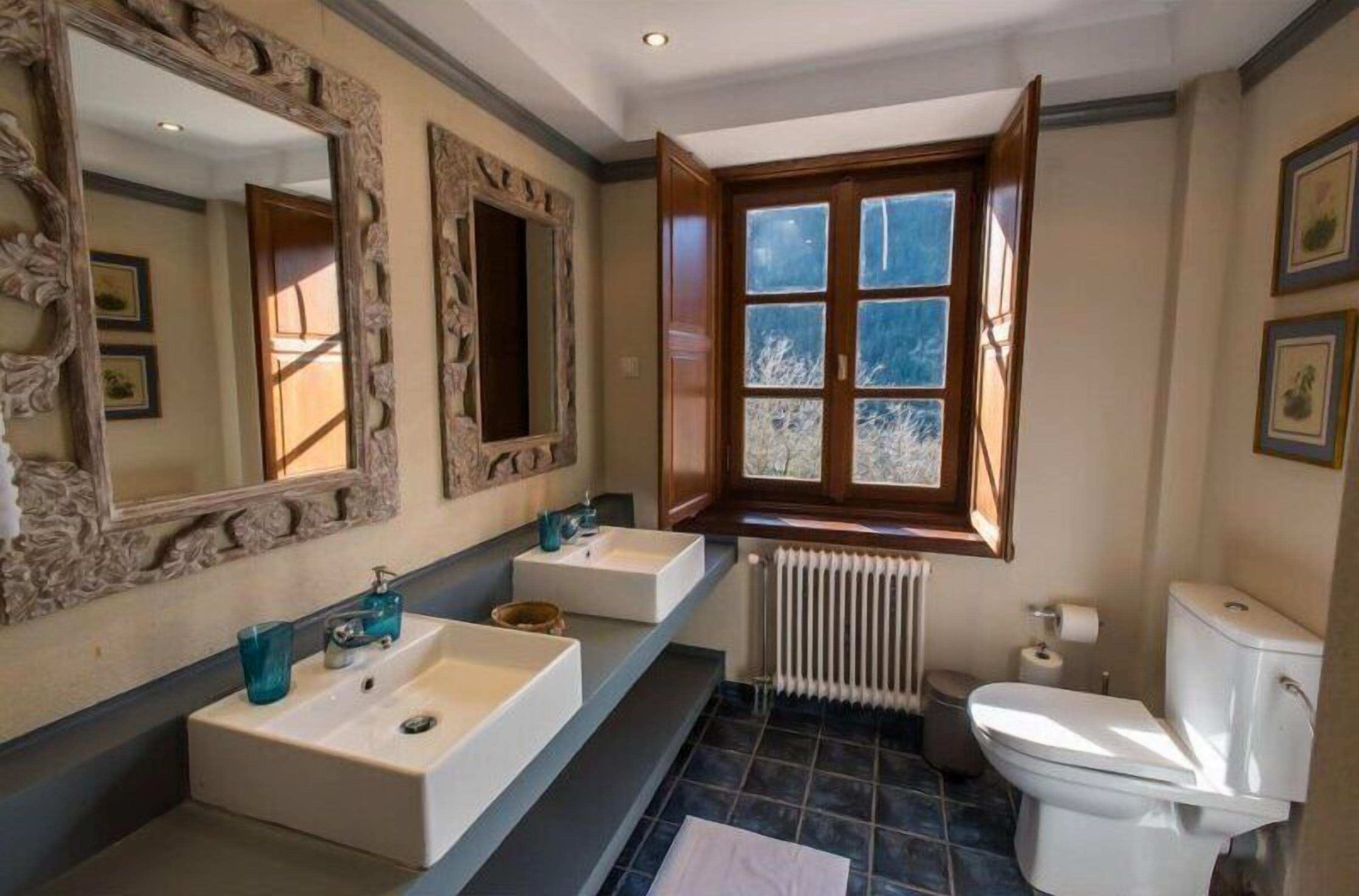 designer toiletries, hair dryer, slippers, towels