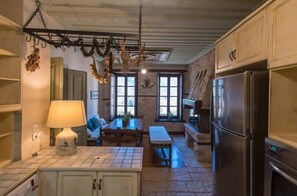 Family Suite | Living area | LED TV, fireplace, DVD player - Epoches Luxury Suites (Karpenisi)