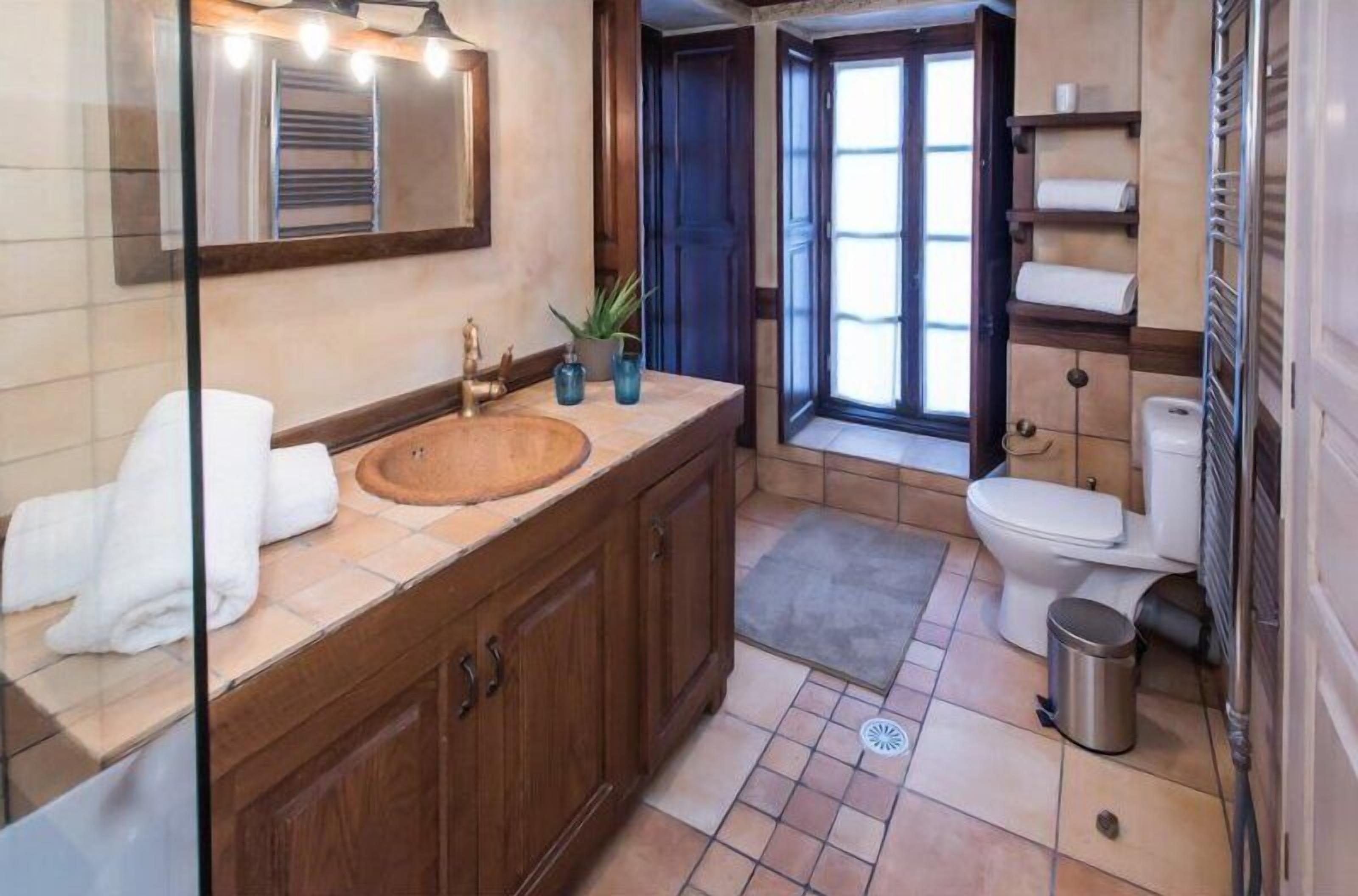 family suite | bathroom | designer toiletries, hair dryer, slippers, towels