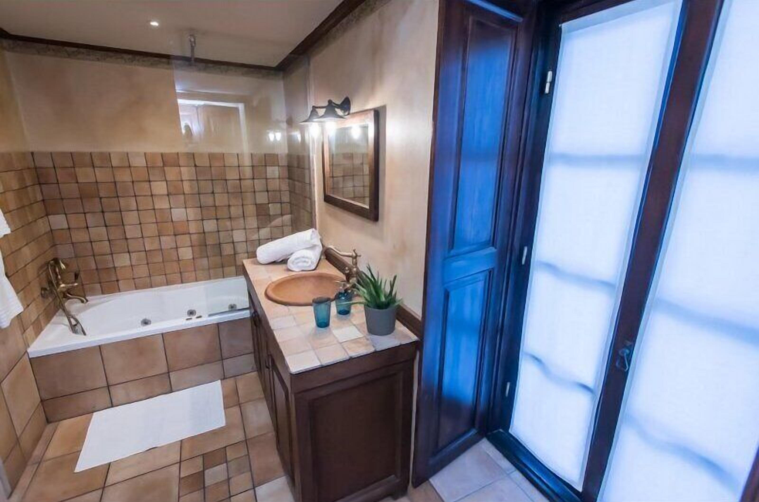 family suite | bathroom | designer toiletries, hair dryer, slippers, towels