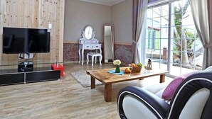 Songi 5,6 (2 Bedrooms) | Living area | Flat-screen TV - GCHGR Pension (Seogwipo)
