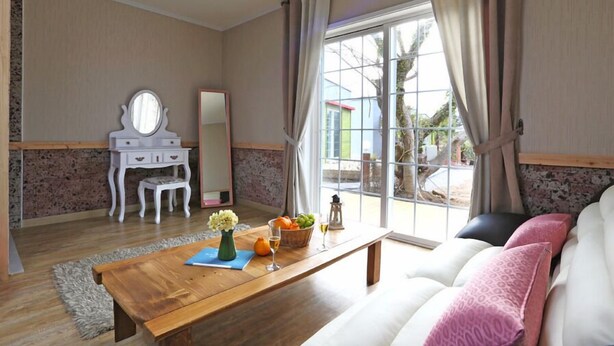 Okdol 8 (1 Bedroom) | Living area | Flat-screen TV - GCHGR Pension (Seogwipo)
