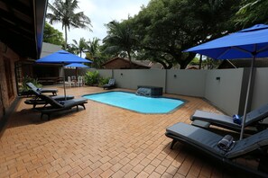 Outdoor pool, open 7:00 AM to 7:00 PM, pool umbrellas, sun loungers