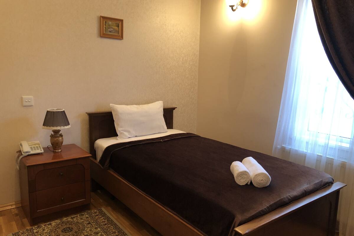 Standard Single Room, 1 Large Twin Bed, Non Smoking | Minibar, in-room safe, desk, iron/ironing board (on request)
