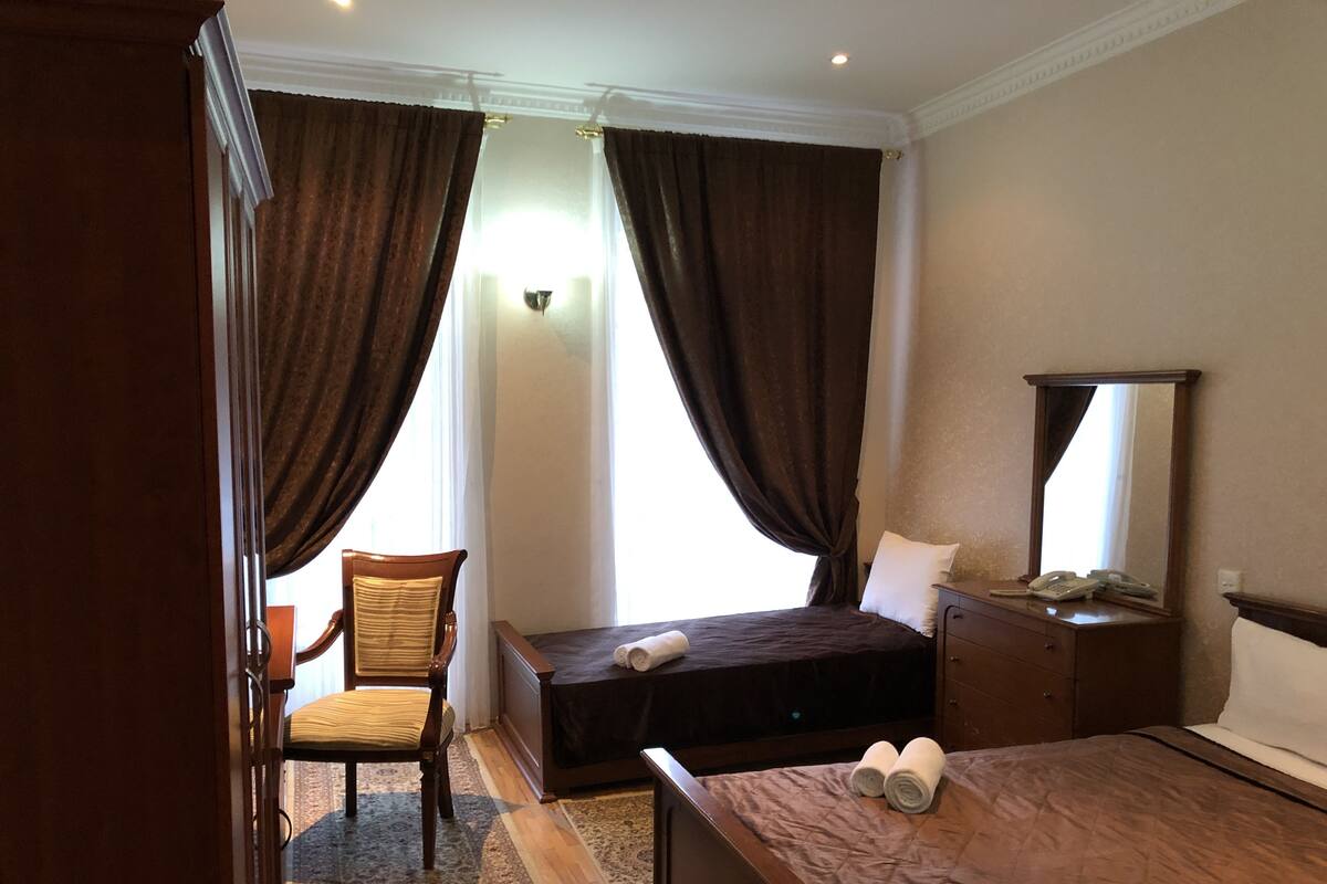 Standard Triple Room, Multiple Beds, Non Smoking | Minibar, in-room safe, desk, iron/ironing board (on request)
