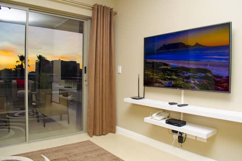 55-inch flat-screen TV with satellite channels, TV
