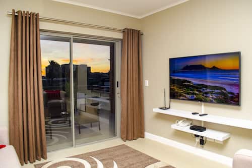 55-inch flat-screen TV with satellite channels, TV