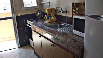 Apartment, 1 Bedroom | Private kitchen | Full-sized fridge, microwave, oven, stovetop