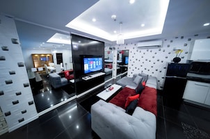 Honeymoon Loft, 1 King Bed, Private Pool | Living area | 49-inch LED TV with digital channels, TV, pay movies