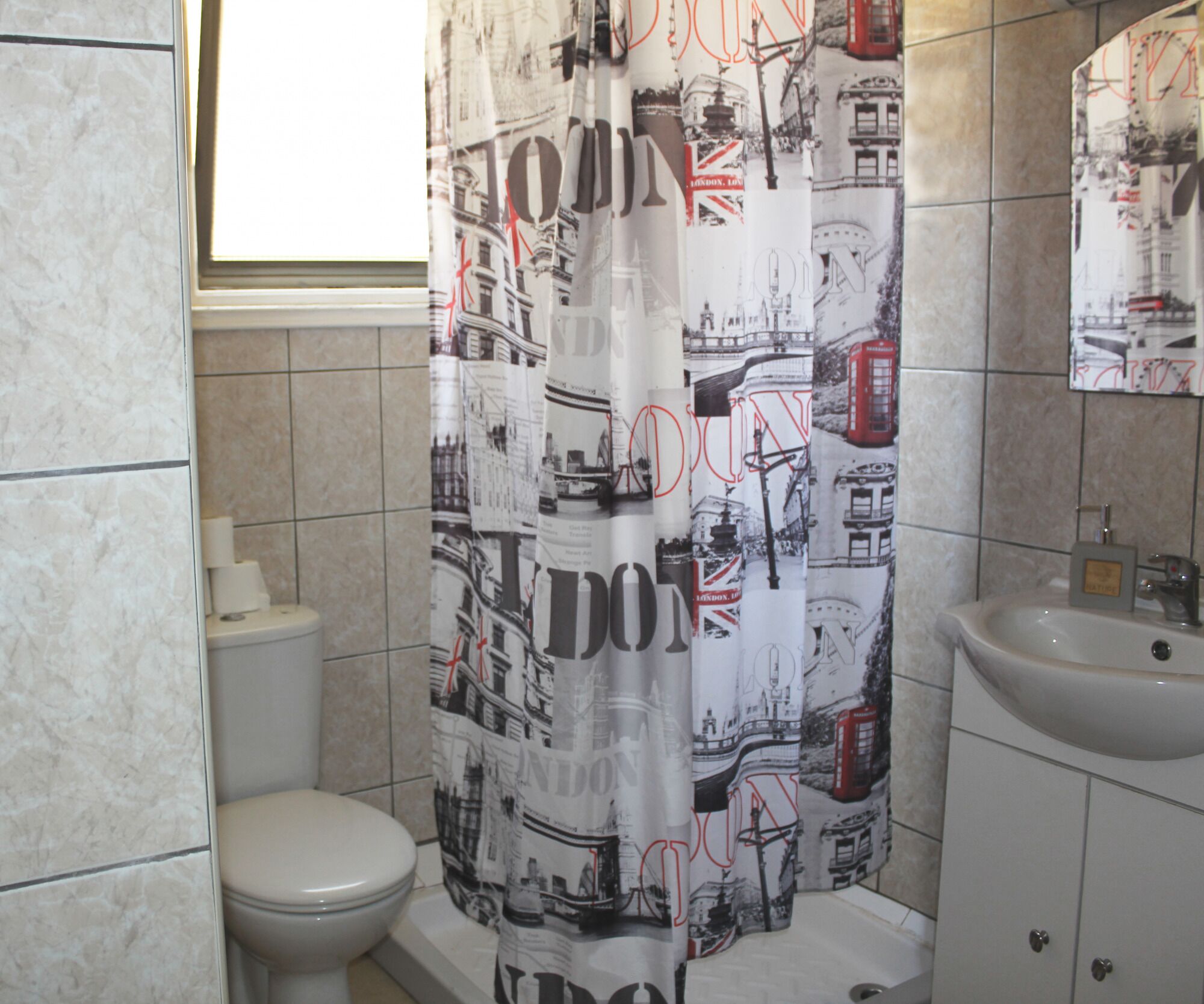 shower, rainfall showerhead, hair dryer, towels