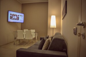 Family Suite, Balcony | Living room | 32-inch LED TV with digital channels, TV - Brain Rooms & Suite (Pagani)