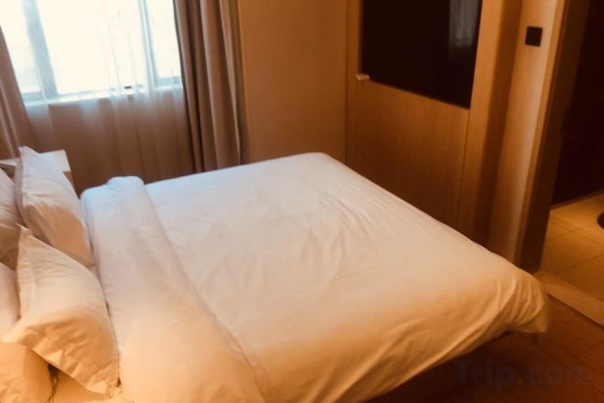Luxe beddengoed, donsdekens, pillowtop-bedden, een minibar