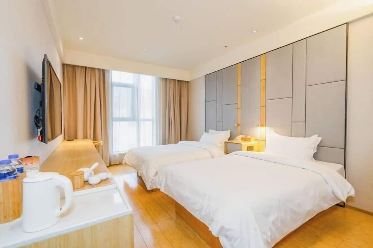 Luxe beddengoed, donzen dekbedden, pillowtop-bedden, een minibar
