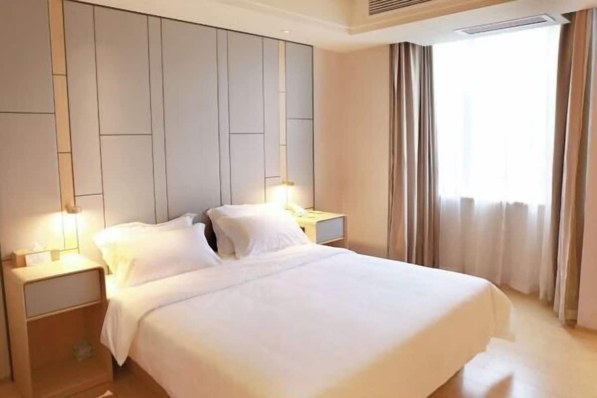 Premium bedding, down comforters, pillowtop beds, minibar