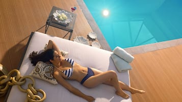 Relax by the pool with a refreshing drink and a beautiful view.