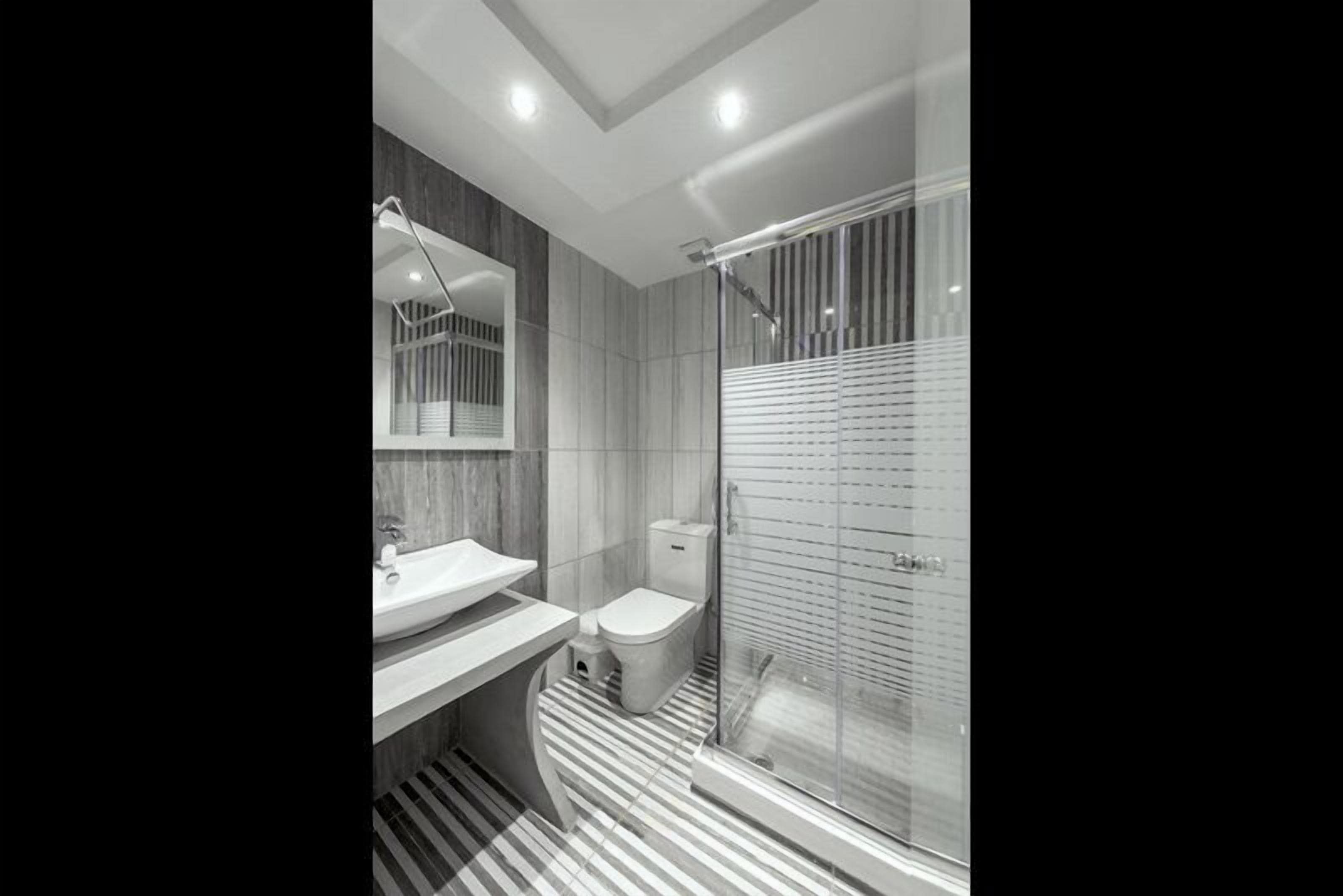 superior triple room | bathroom | shower, free toiletries, hair dryer, slippers