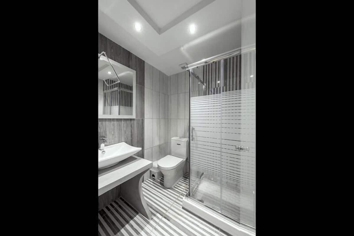 superior triple room | bathroom | shower, free toiletries, hair dryer, slippers