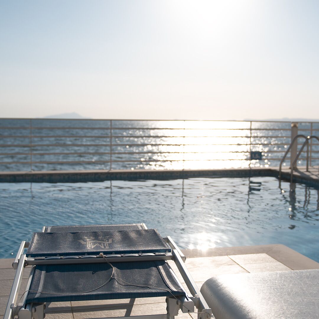 seasonal outdoor pool, open 9:00 am to 7:00 pm, pool loungers