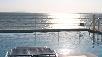 Seasonal outdoor pool, open 9:00 AM to 7:00 PM, sun loungers