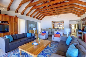 Luxury Apartment | Living area | 64-inch Smart TV with satellite channels, DVD player, pay movies