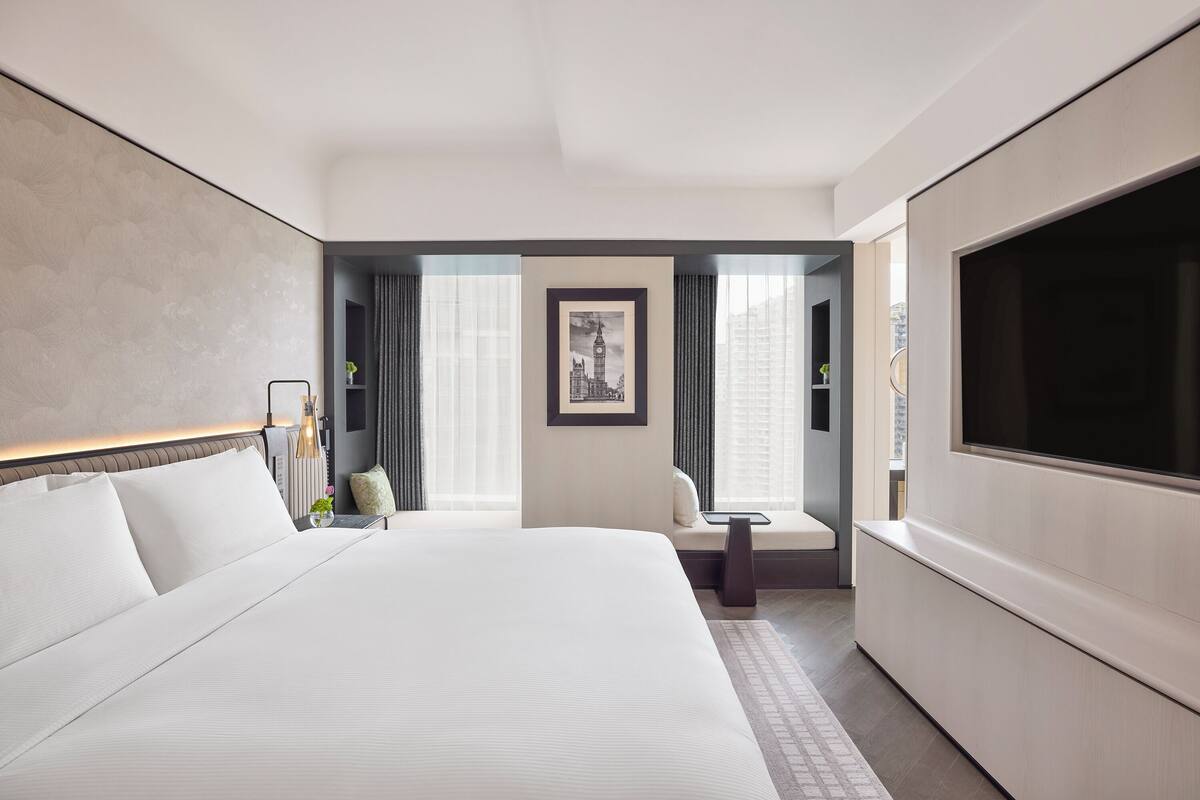 Deluxe-svíta | Rúmföt af bestu gerð, dúnsængur, rúm með Select Comfort dýnum, míníbar