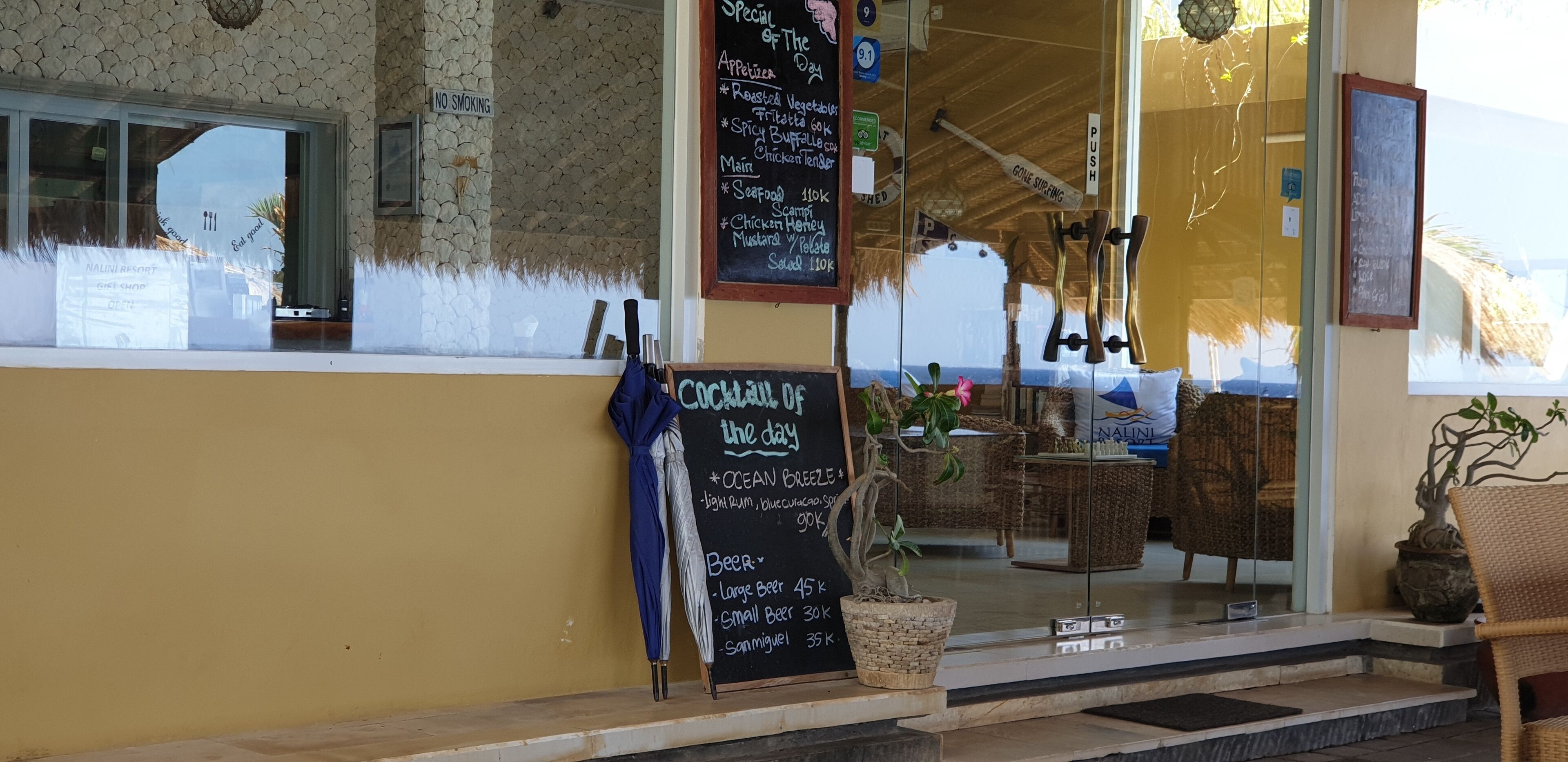 A restaurant with a chalkboard menu listing daily specials, a 'No Smoking' sign, and a 'Push' sign.