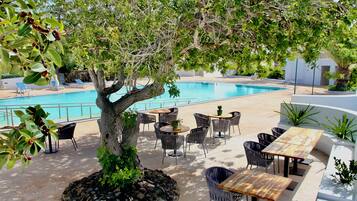 Indoor pool, outdoor pool, pool umbrellas, pool loungers