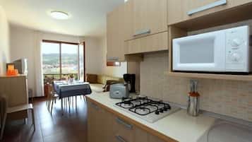 Full-size fridge, microwave, stovetop, dishwasher